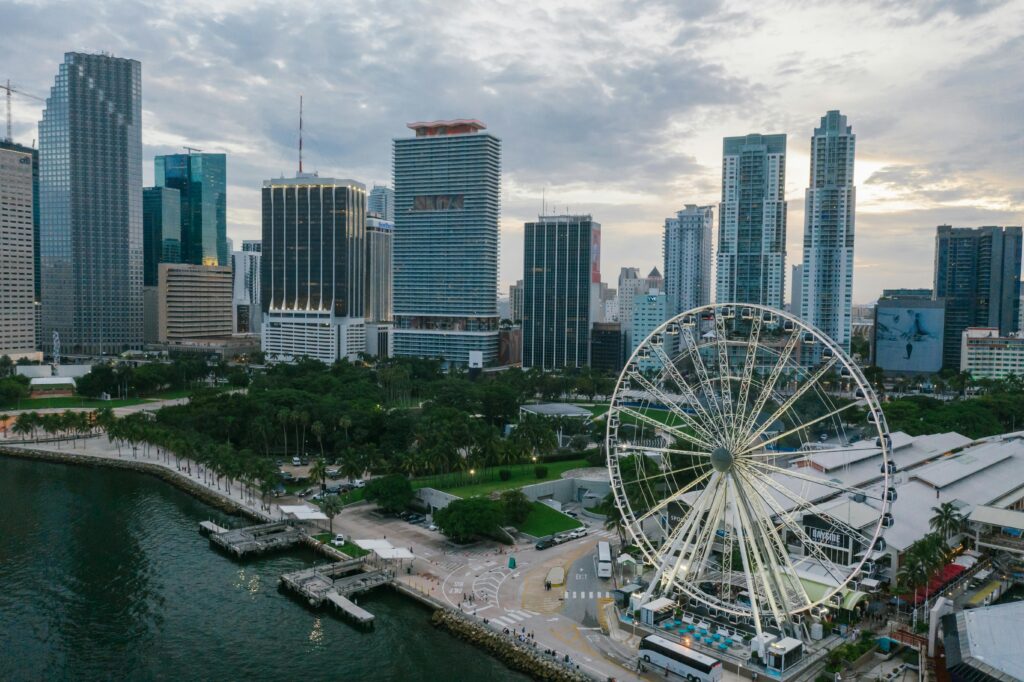 Explore the vibrant Miami skyline with a glimpse of the iconic Ferris wheel, perfect for travel enthusiasts.